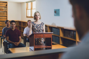 UWA Law School student standing at podium in moot court