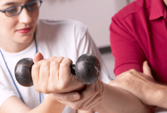 occupational therapist working with client to strengthen wrist