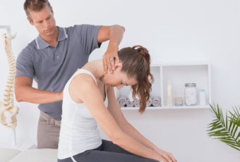 chiropractor adjusting patient's neck