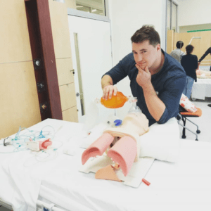 UQ Medical School graduate Daniel Brimm with medical dummy