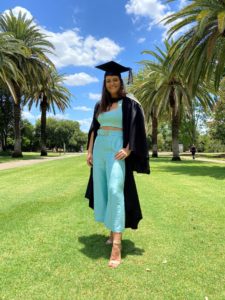 uq vet graduate in cap and gown