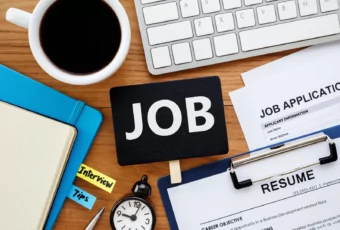 cluttered desk with resume