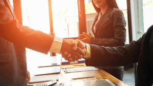 Email us! business team members shaking hands