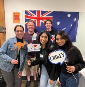 young adults posing in front of Australia flag