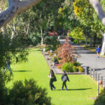 la trobe university campus with students walking on grass