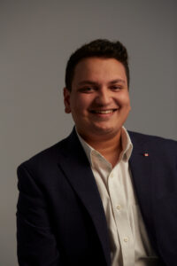 Learn more about the Monash JD program headshot of man wearing blazer and white shirt