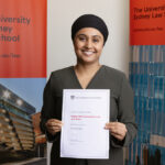 sydney law school juris doctor student avneet holding her scholarship award certificate