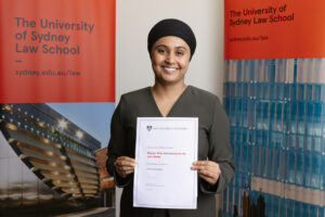 sydney law school juris doctor student avneet holding her scholarship award certificate