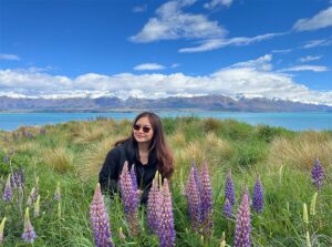 woman in field with purple flowers